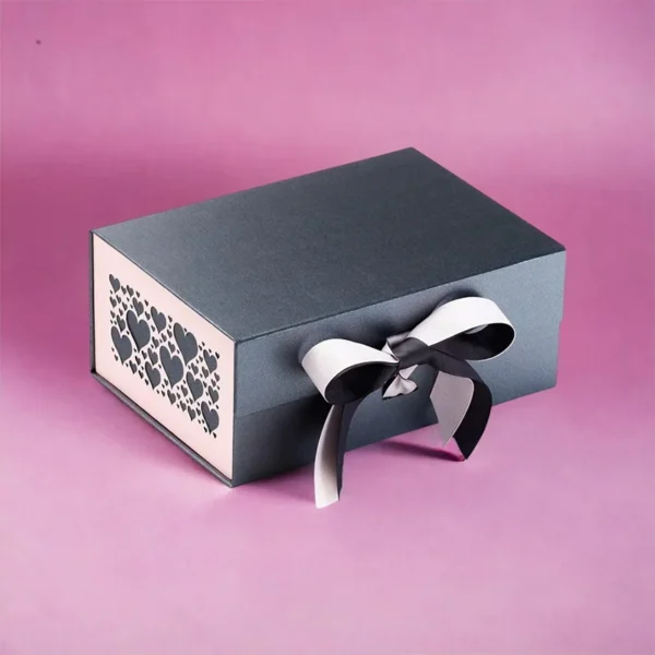 Fancy rigid gift box with ribbon and custom foil logo.