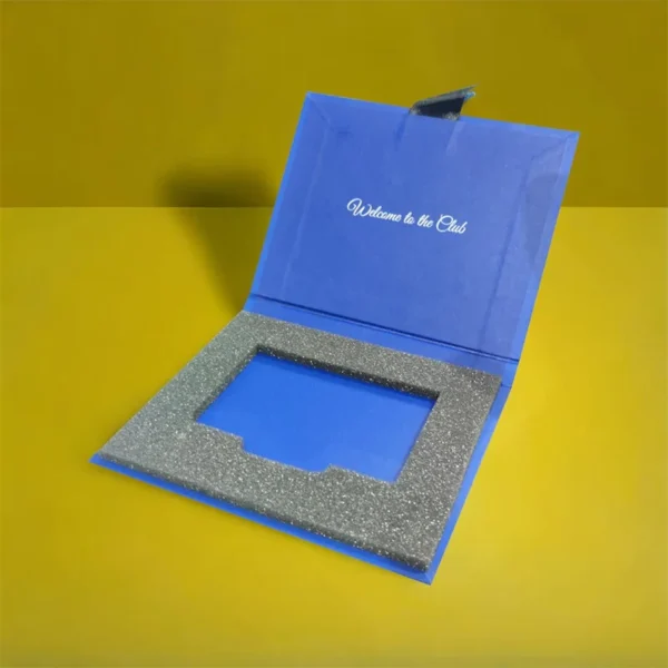 Deluxe rigid gift card box with velvet lining and ribbon.