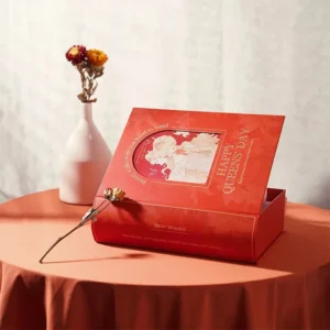 Gourmet rigid box with clear window for food presentation.